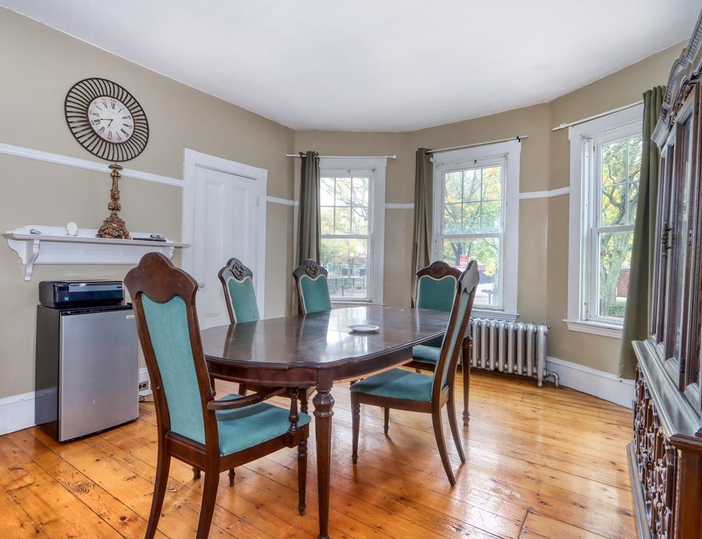 31-33 Rockingham Street Cambridge, MA 02139 - Photo 11 of 22 a view of a dining room with furniture window and wooden floor