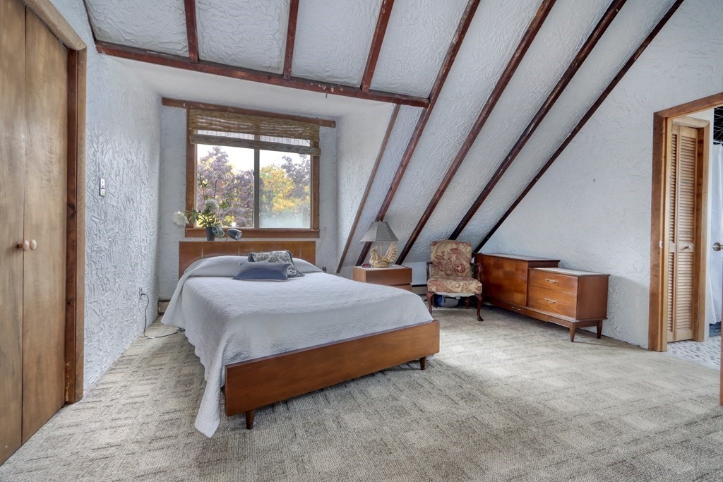 31-33 Rockingham Street Cambridge, MA 02139 - Photo 15 of 22 a bedroom with a bed and a window