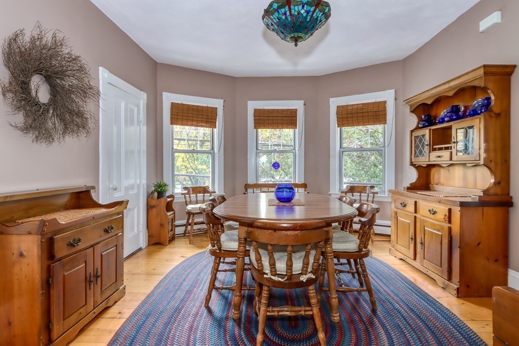 31-33 Rockingham Street Cambridge, MA 02139 - Photo 7 of 22 a view of a dining room with furniture window and wooden floor