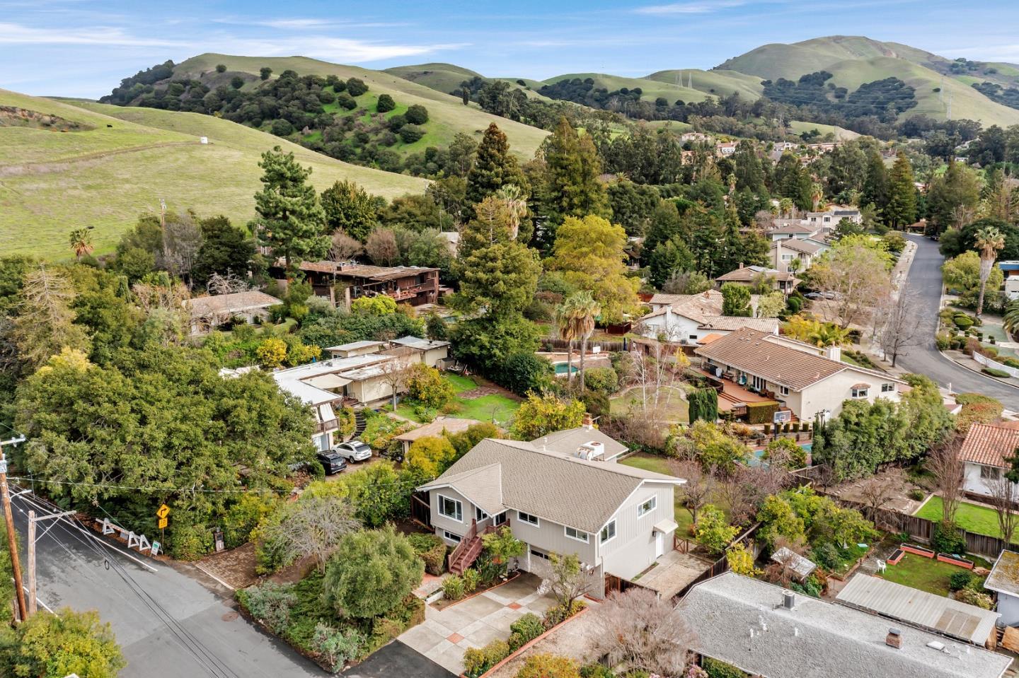 an aerial view of residential houses with outdoor space