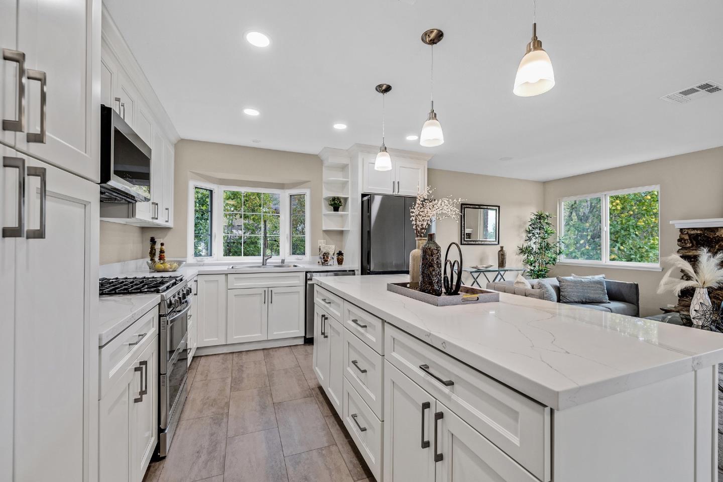 180 Mill Creek Road Fremont, CA 94539 - Photo 11 of 55 a kitchen with white cabinets and appliances