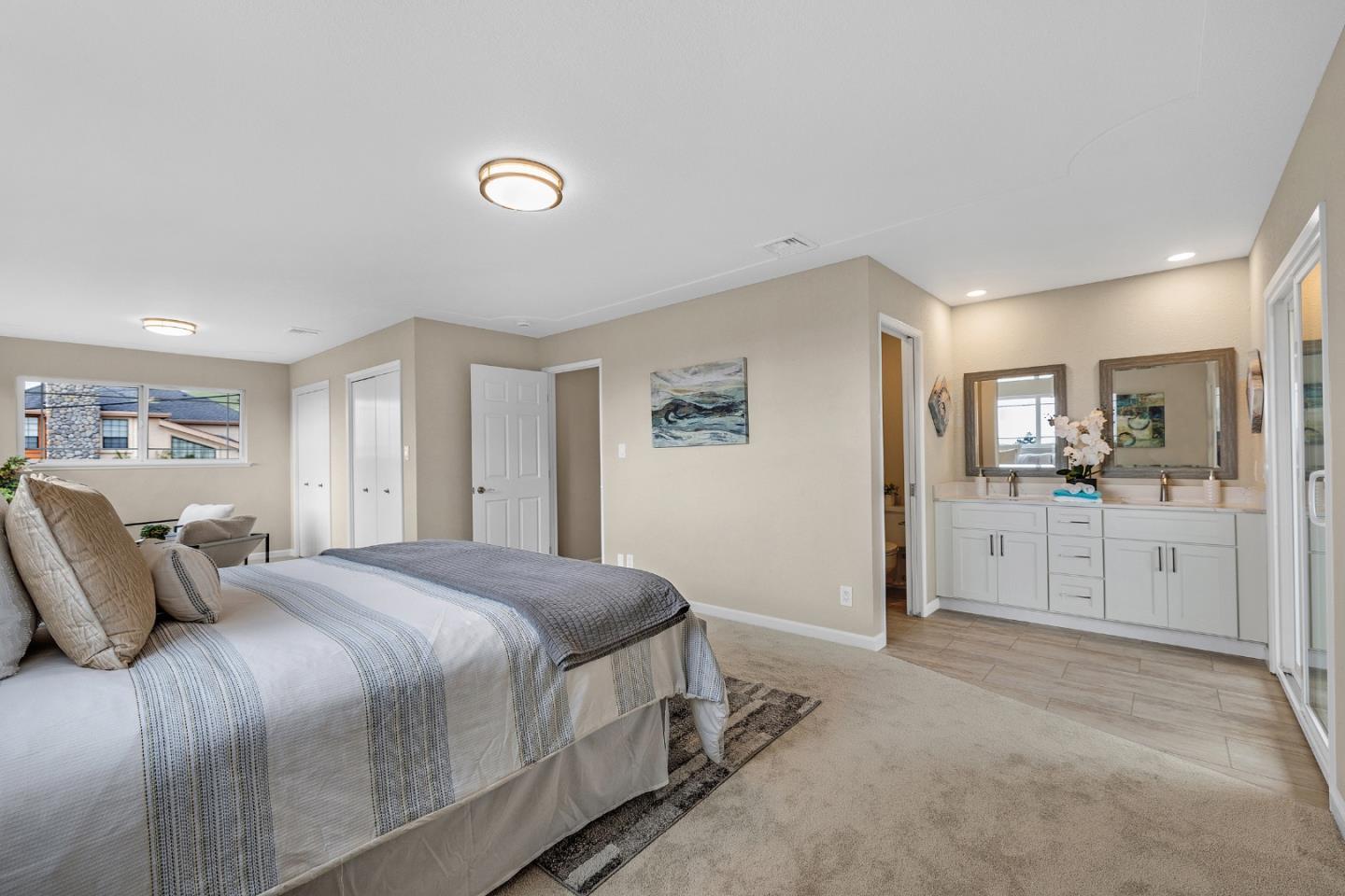 180 Mill Creek Road Fremont, CA 94539 - Photo 23 of 55 a spacious bedroom with a bed and a view of kitchen