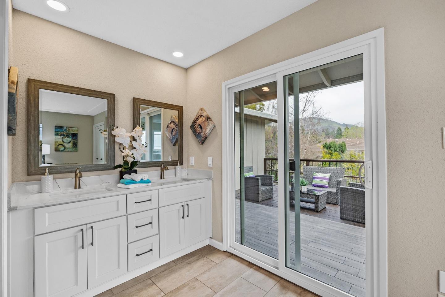180 Mill Creek Road Fremont, CA 94539 - Photo 24 of 55 a bathroom with a double vanity sink and mirror