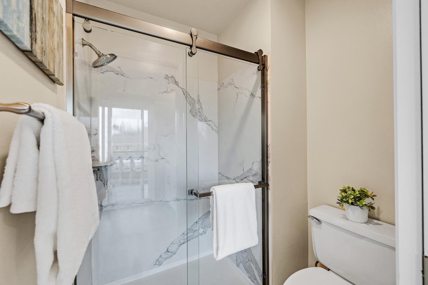 180 Mill Creek Road Fremont, CA 94539 - Photo 25 of 55 a bathroom with a shower a toilet and a shower