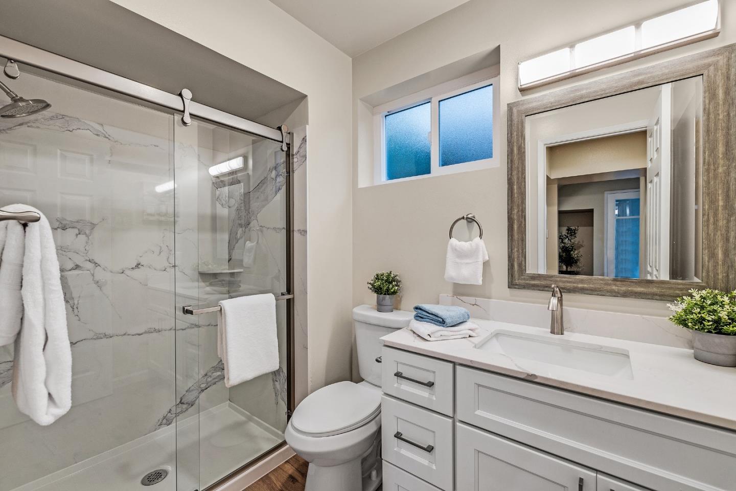 180 Mill Creek Road Fremont, CA 94539 - Photo 37 of 55 a bathroom with a sink toilet and shower