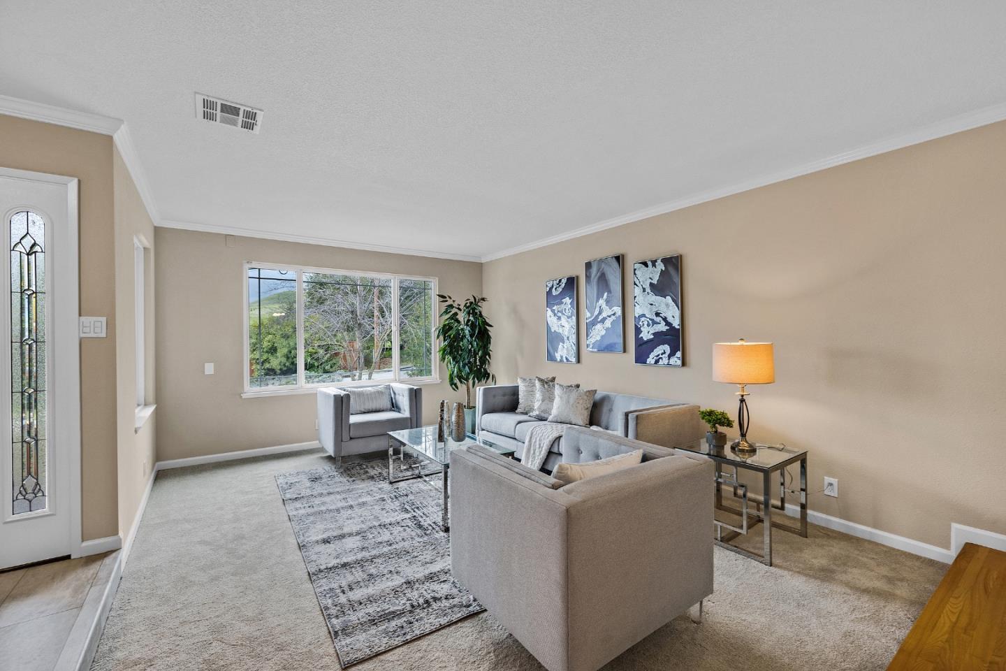 180 Mill Creek Road Fremont, CA 94539 - Photo 4 of 55 a living room with furniture and a lamp