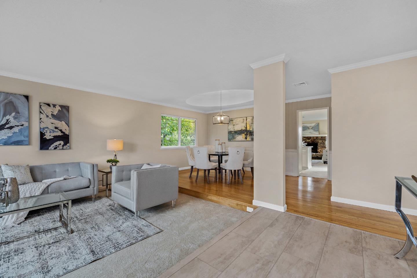 180 Mill Creek Road Fremont, CA 94539 - Photo 5 of 55 a living room with furniture and a table with wooden floor