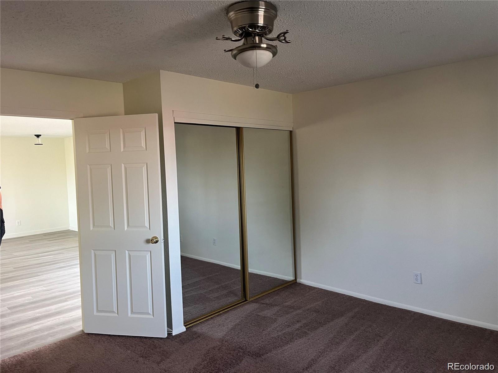 24395 Main Street Elbert, CO 80106 - Photo 13 of 26 wooden floor in an empty room
