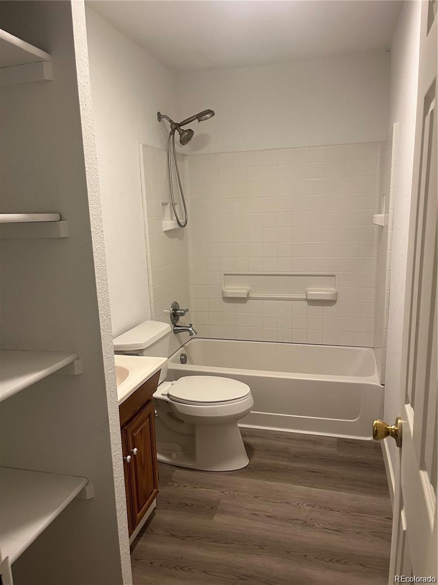 24395 Main Street Elbert, CO 80106 - Photo 17 of 26 a bathroom with a toilet a sink and a shower