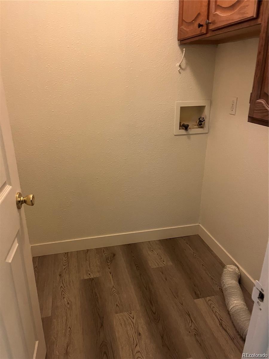24395 Main Street Elbert, CO 80106 - Photo 19 of 26 a view of a room with wooden floor