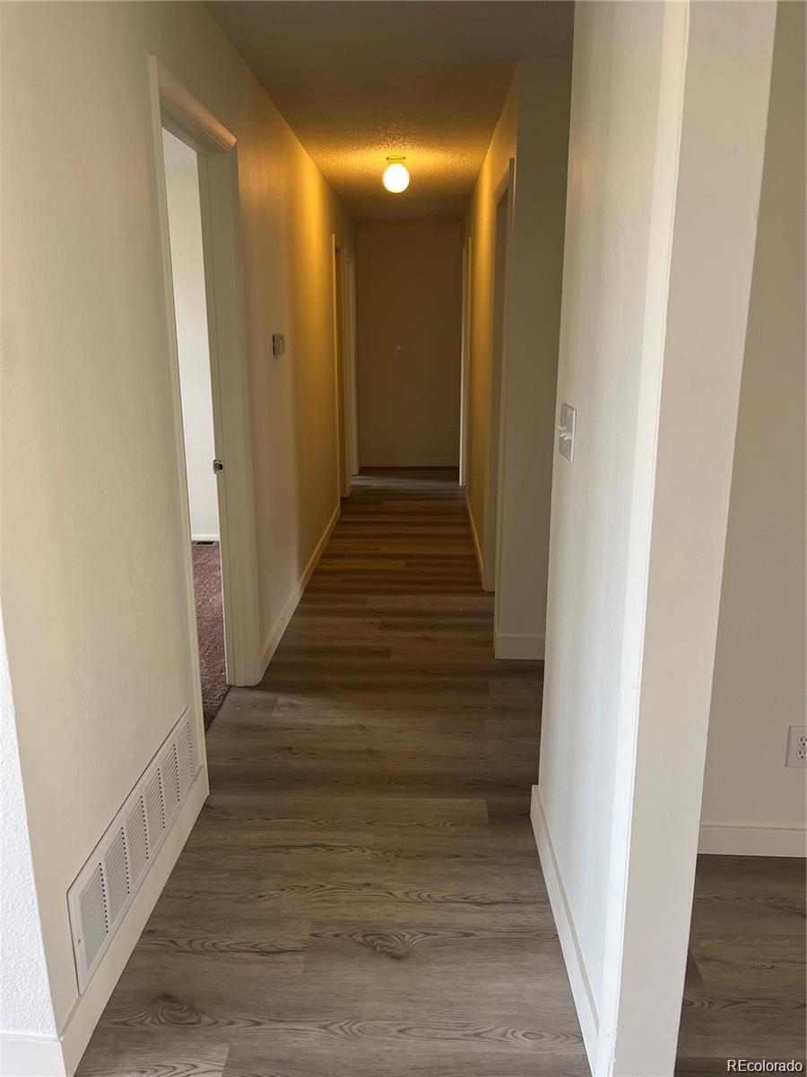 24395 Main Street Elbert, CO 80106 - Photo 7 of 26 a view of entryway and hall with wooden floor