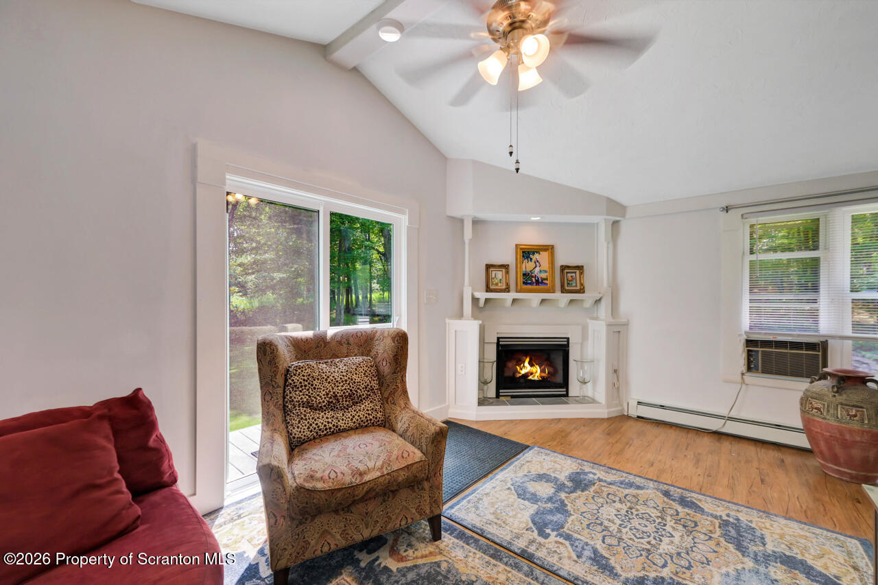 3660 Aberdeen Road Moscow, PA 18444 - Photo 29 of 68 a living room with furniture and a fireplace