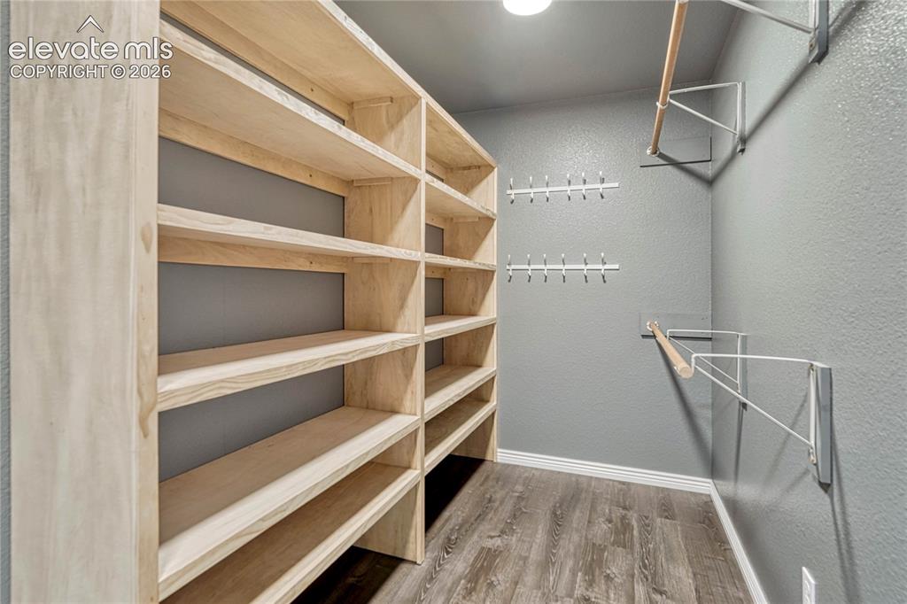 13695 Woodlake Road Elbert, CO 80106 - Photo 21 of 39 Primary bedroom walk-in closet.