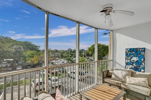 a view of a balcony with furniture