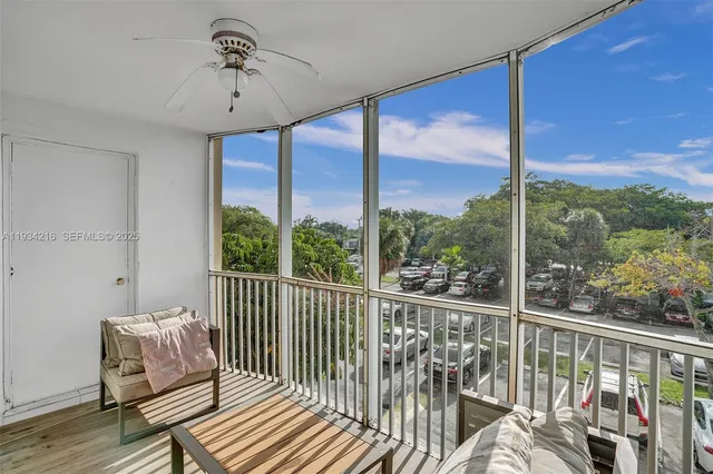 a view of a balcony with furniture