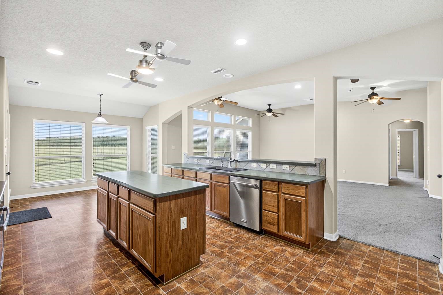 329 Gou Hole Road Cove, TX 77523 - Photo 19 of 19 a kitchen with stainless steel appliances granite countertop a stove and a sink