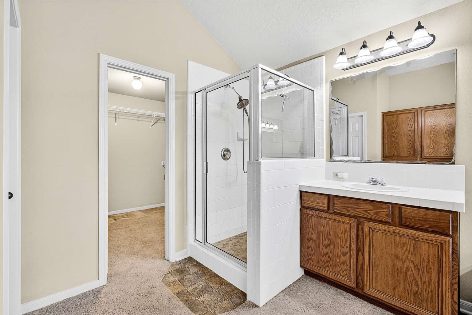 329 Gou Hole Road Cove, TX 77523 - Photo 8 of 19 a bathroom with a double vanity sink mirror and shower