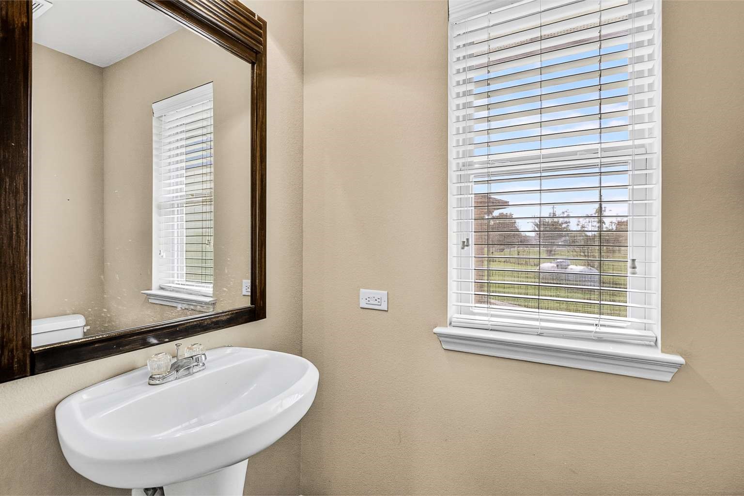 329 Gou Hole Road Cove, TX 77523 - Photo 9 of 19 a bathroom with a sink and a window