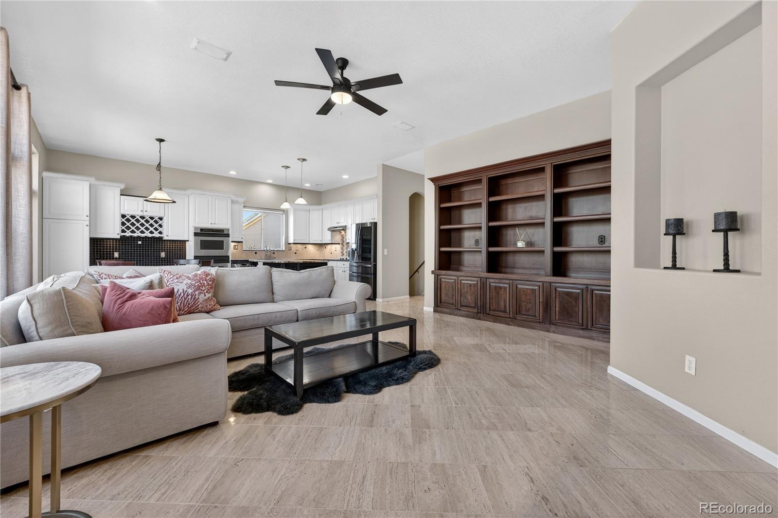 10155 Joseph Drive Highlands Ranch, CO 80124 - Photo 18 of 50 a living room with furniture and natural light