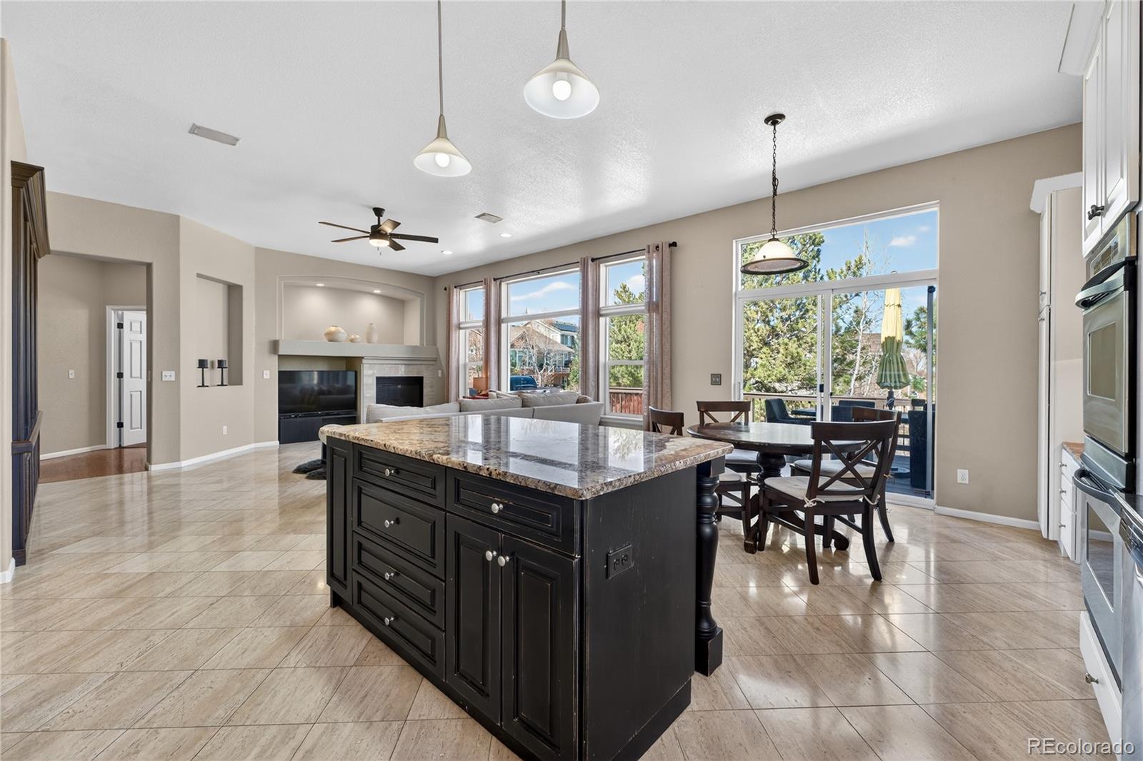 10155 Joseph Drive Highlands Ranch, CO 80124 - Photo 24 of 50 a kitchen with stainless steel appliances granite countertop a stove and a refrigerator