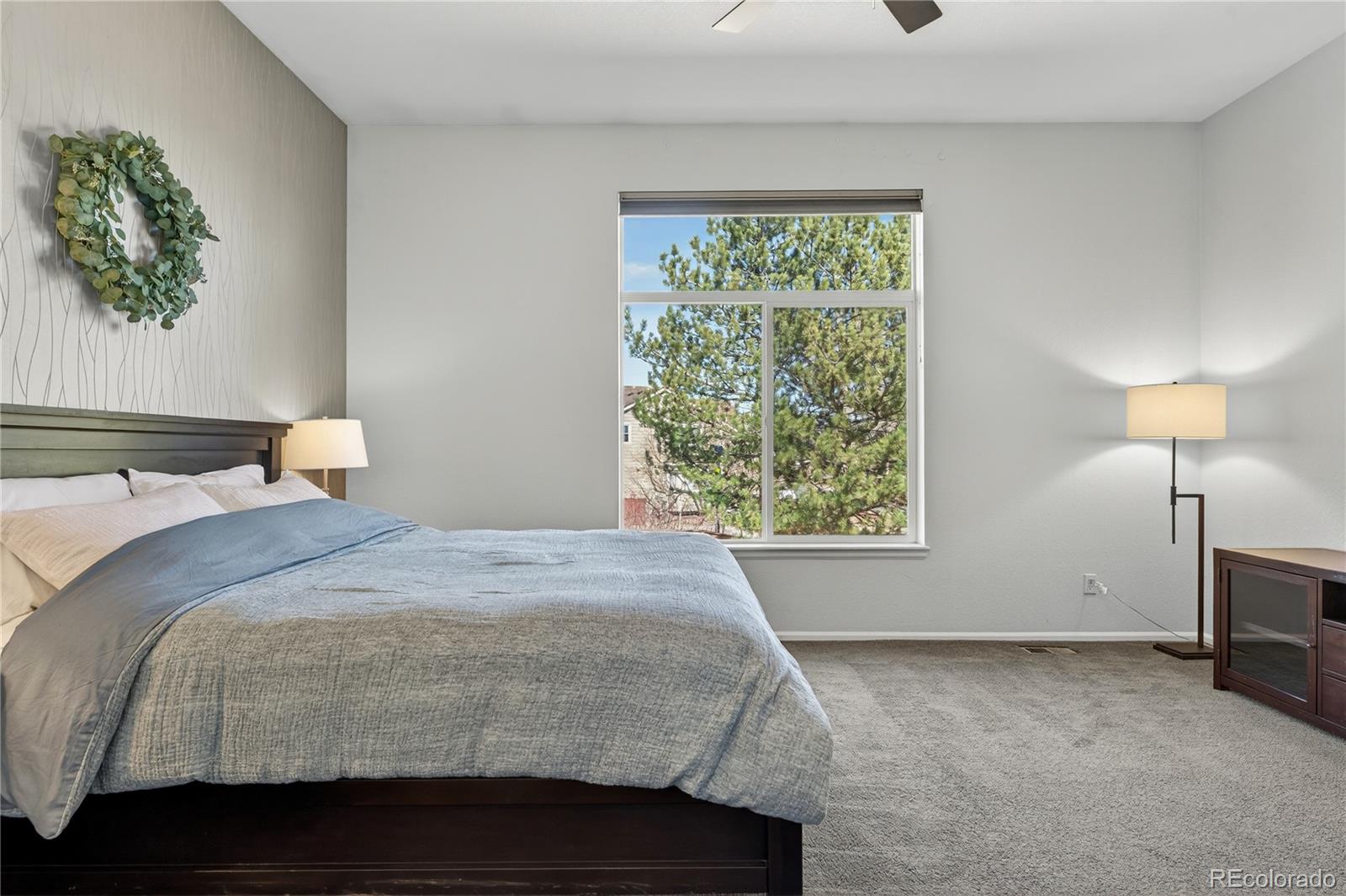 10155 Joseph Drive Highlands Ranch, CO 80124 - Photo 32 of 50 a bedroom with a bed and a window