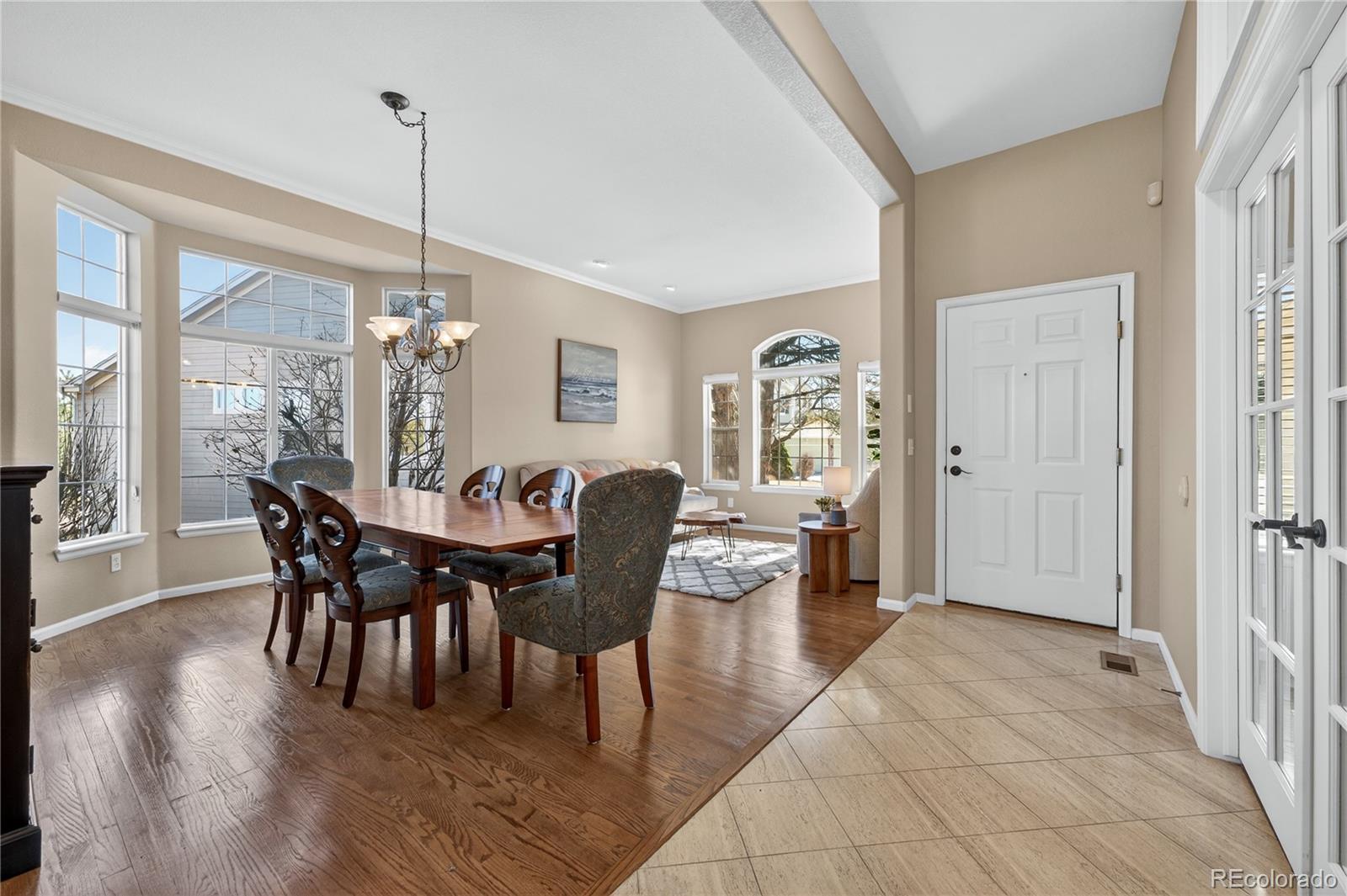 10155 Joseph Drive Highlands Ranch, CO 80124 - Photo 4 of 50 a view of a dining room with furniture window and wooden floor