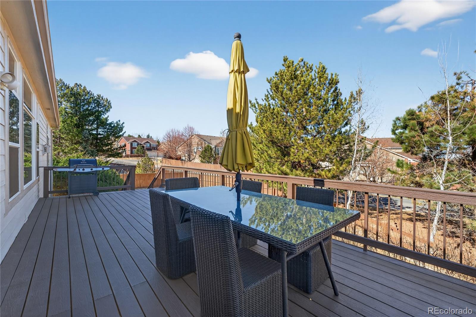 10155 Joseph Drive Highlands Ranch, CO 80124 - Photo 44 of 50 a terrace view with sitting space and trees