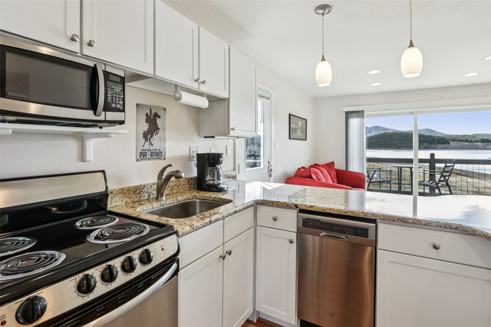 144 Gold Run Circle, Unit 17 Dillon, CO 80435 - Photo 6 of 38 a kitchen that has a sink and a stove