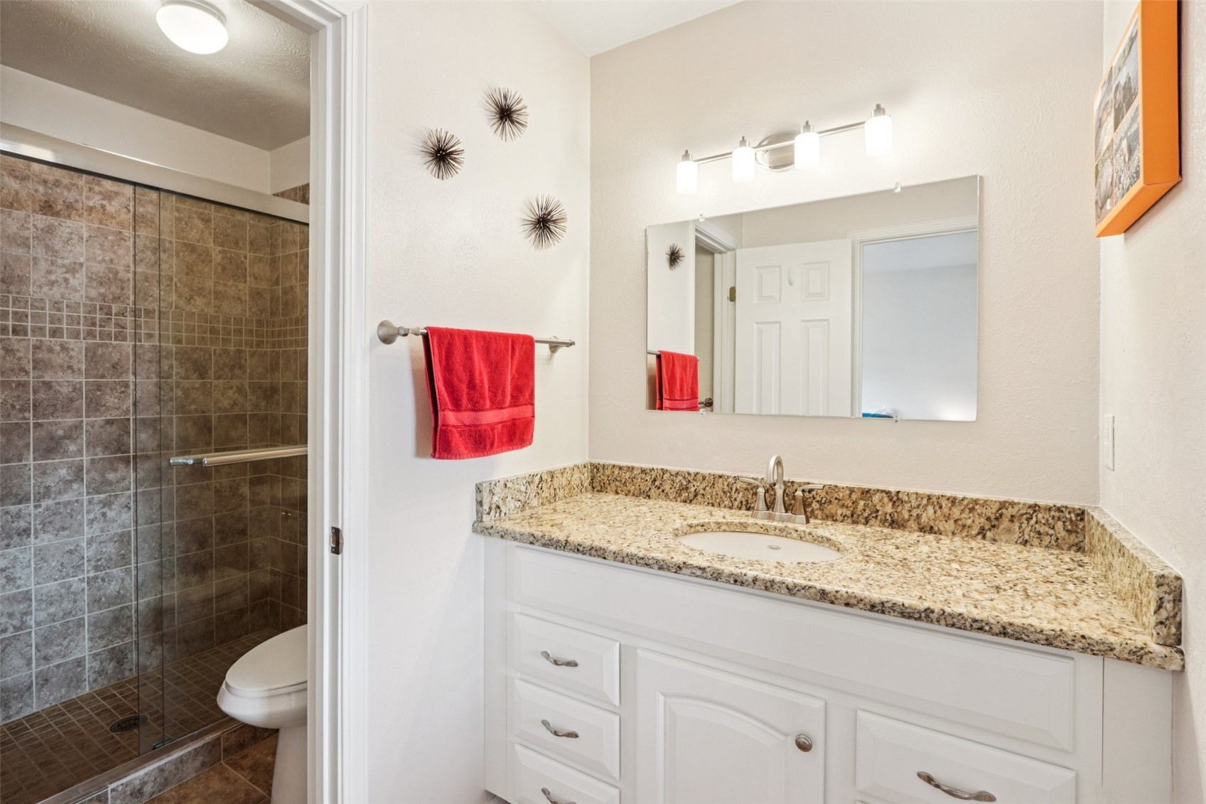 144 Gold Run Circle, Unit 17 Dillon, CO 80435 - Photo 7 of 38 a bathroom with a granite countertop sink a toilet and shower