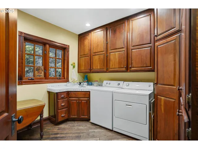 a kitchen with stainless steel appliances granite countertop a refrigerator and cabinets