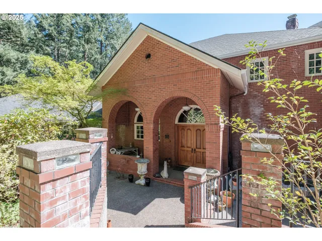 a backyard of a house with outdoor seating