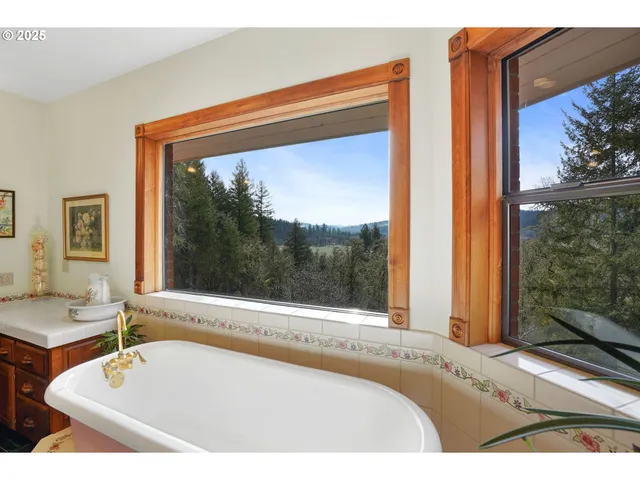 a bath tub sitting in front of a window