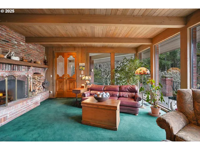 a living room with furniture and a yard