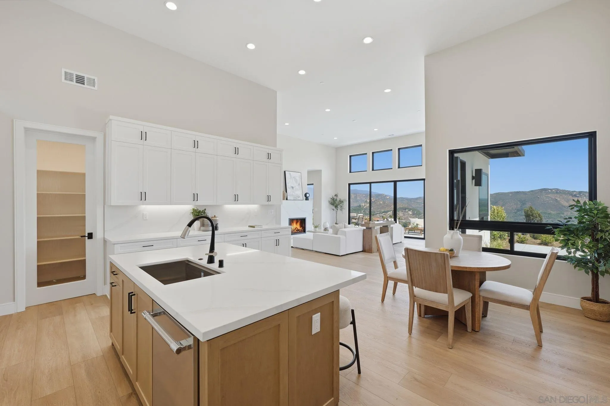 3916 Citrus Drive Fallbrook, CA 92028 - Photo 19 of 72 a kitchen with a sink a counter top space stainless steel appliances and a large window