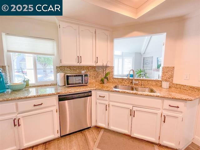 232 O'Neil Circle Hercules, CA 94547 - Photo 8 of 12 a kitchen with granite countertop white cabinets and a stainless steel appliances