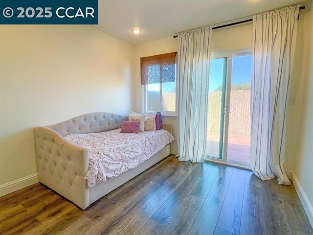 232 O'Neil Circle Hercules, CA 94547 - Photo 10 of 12 a bedroom with a bed and a window