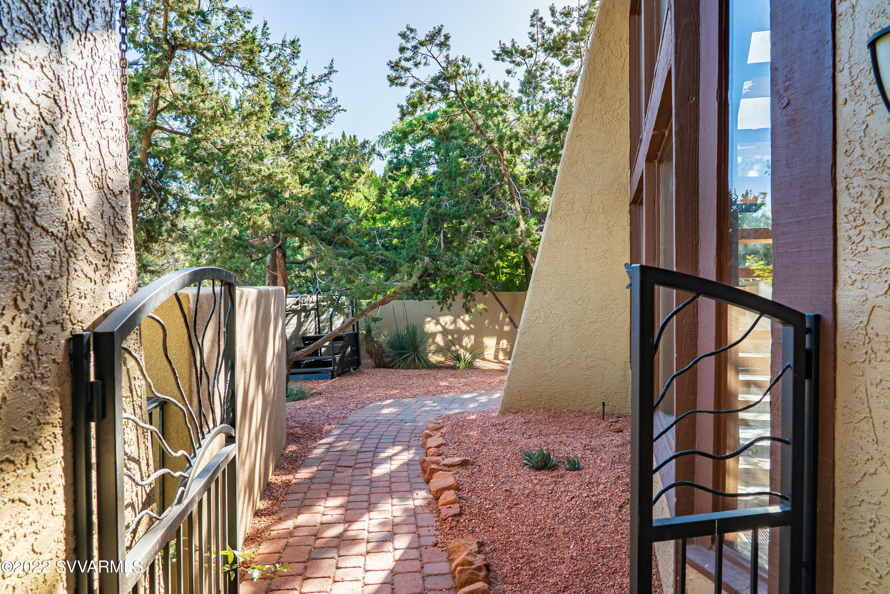 155 Sugarloaf Road Sedona, AZ 86351 - Photo 12 of 53 12_Pavered Path to the Landscaped Backya