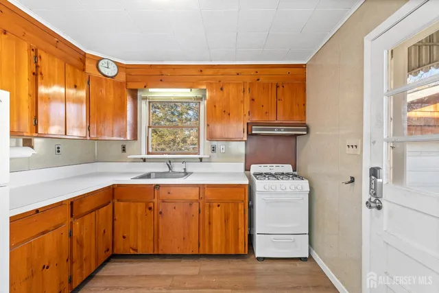 a kitchen with stainless steel appliances granite countertop a stove and a refrigerator