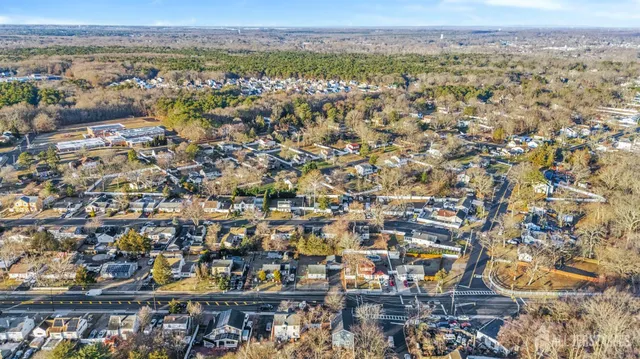 an aerial view of residential building with green space