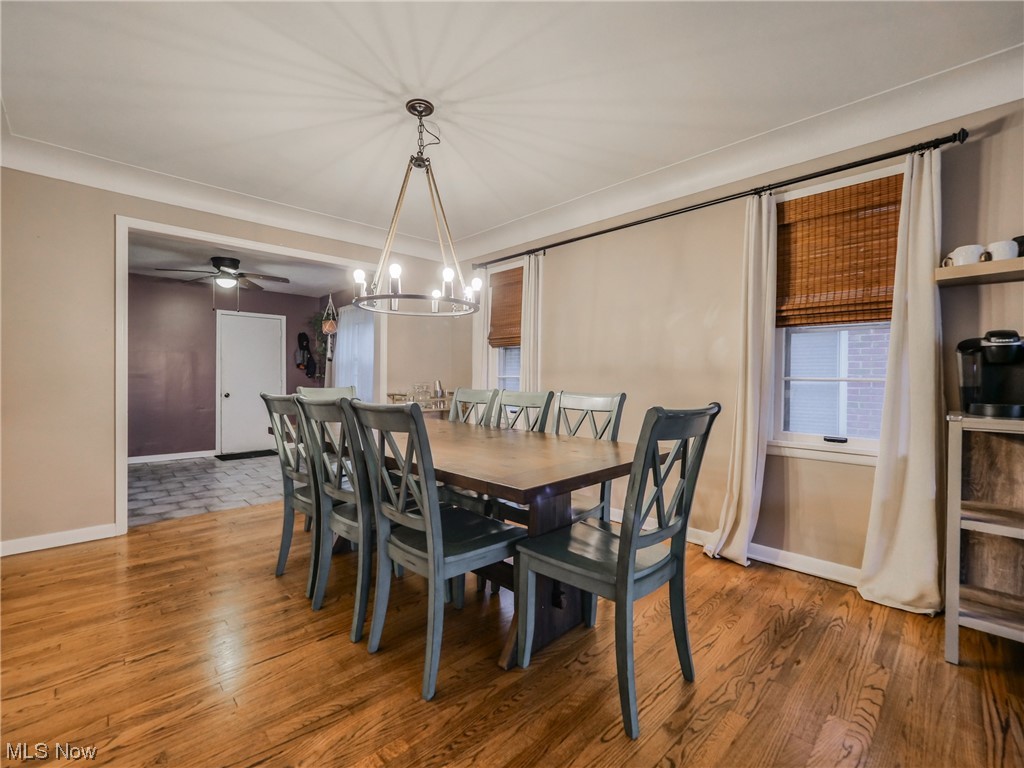 2378 Charney Road Cleveland, OH 44118 - Photo 5 of 28 Dining area with ceiling fan with notable chandelier and hardwood / wood-style floors