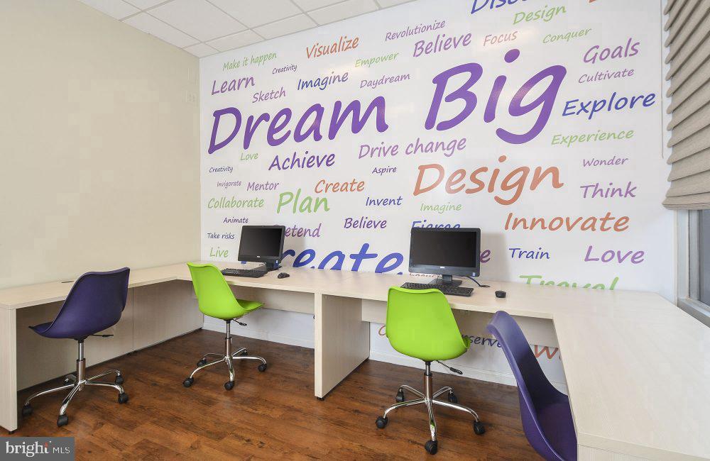 515 West Chelten Avenue, Unit 2B1302 Philadelphia, PA 19144 - Photo 35 of 36 a workspace with furniture and a wooden floor