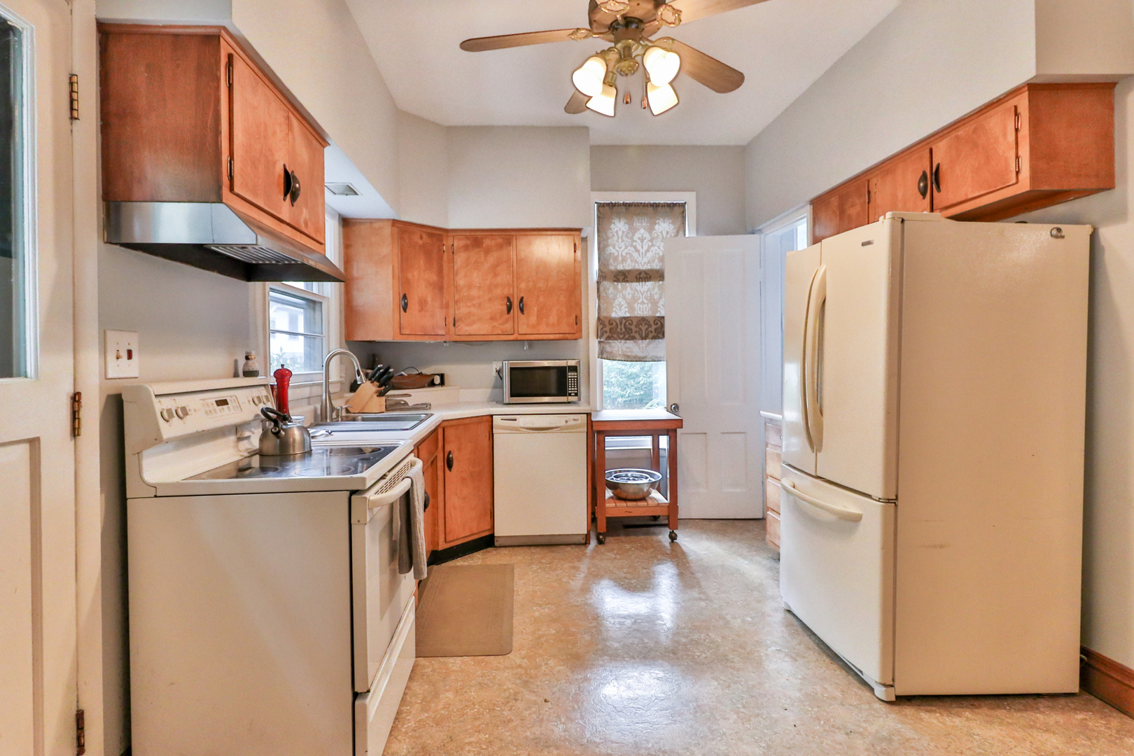 15 Rugby Place Elgin, IL 60120 - Photo 13 of 24 a kitchen with stainless steel appliances granite countertop a refrigerator a sink and a stove