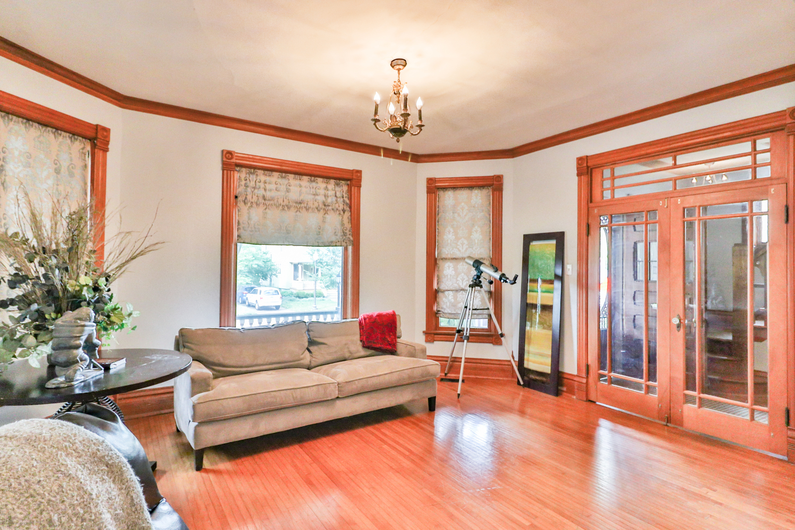 15 Rugby Place Elgin, IL 60120 - Photo 6 of 24 a living room with furniture and a chandelier