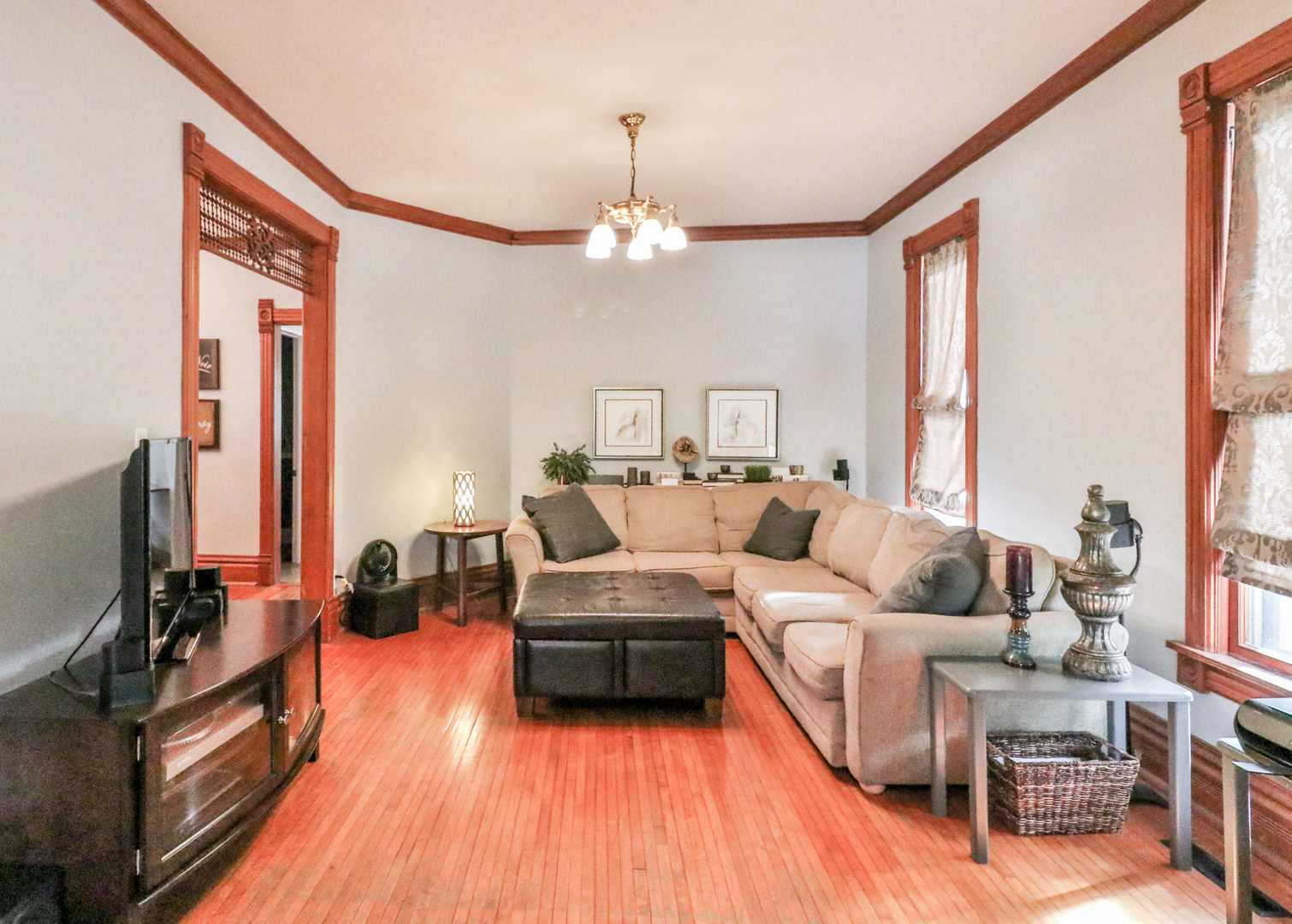 15 Rugby Place Elgin, IL 60120 - Photo 7 of 24 a living room with furniture a large window and a flat screen tv