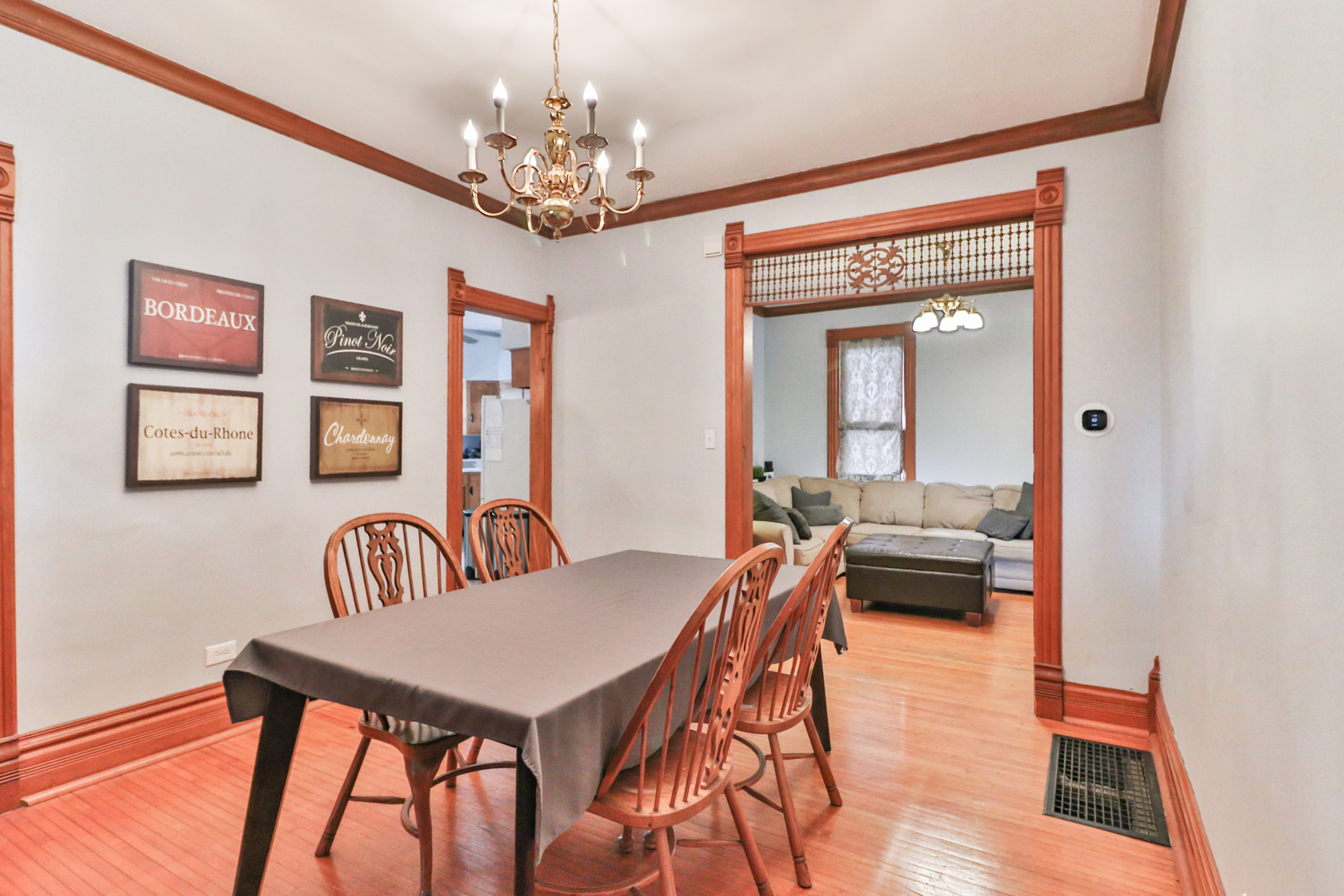 15 Rugby Place Elgin, IL 60120 - Photo 10 of 24 a view of a dining room with furniture a chandelier and wooden floor