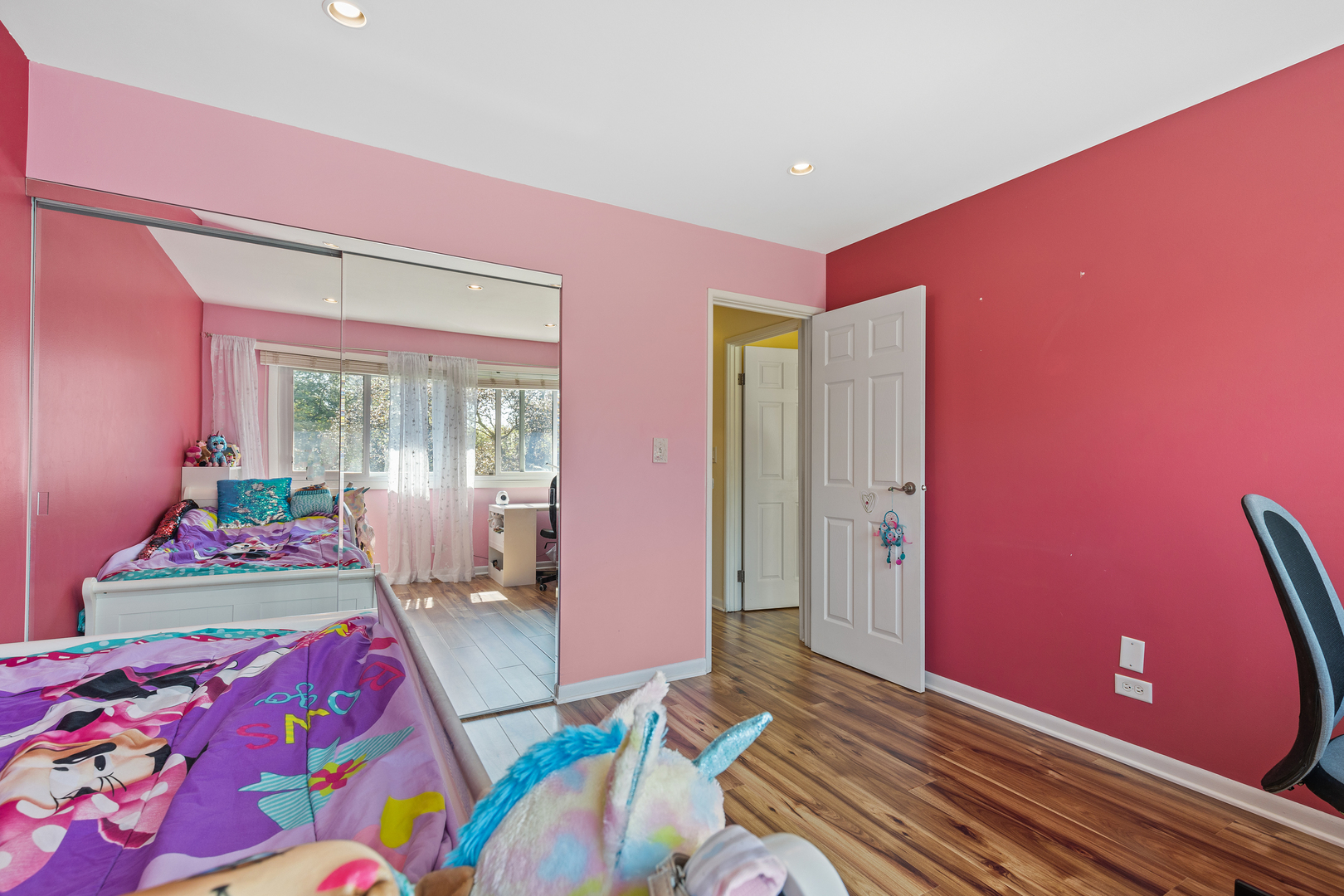 833 Swallow Street Deerfield, IL 60015 - Photo 21 of 37 a bedroom with a bed and wooden floor