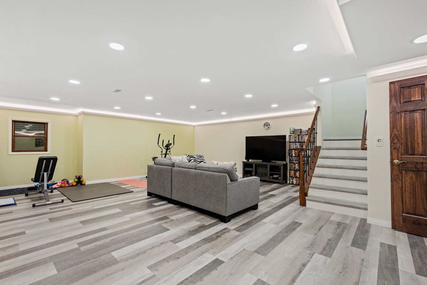 833 Swallow Street Deerfield, IL 60015 - Photo 22 of 37 a living room with furniture flat screen tv and a table