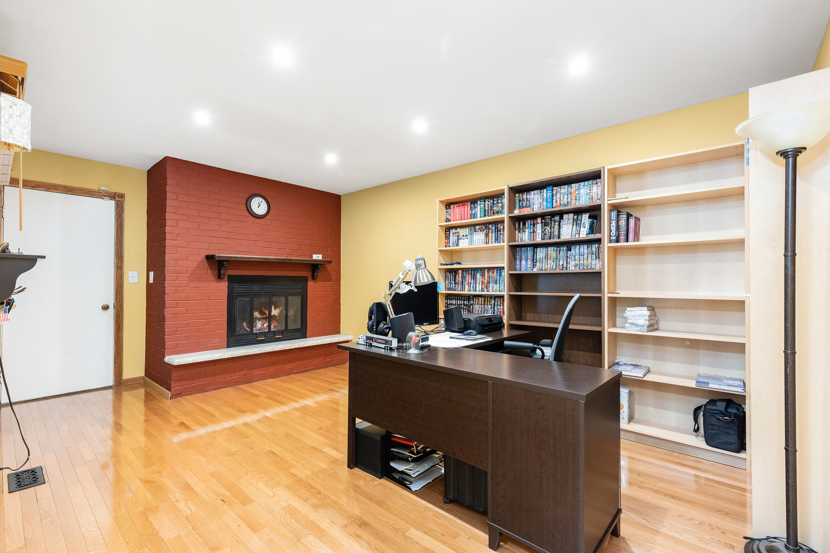 833 Swallow Street Deerfield, IL 60015 - Photo 3 of 37 a livingroom with workspace and a fireplace