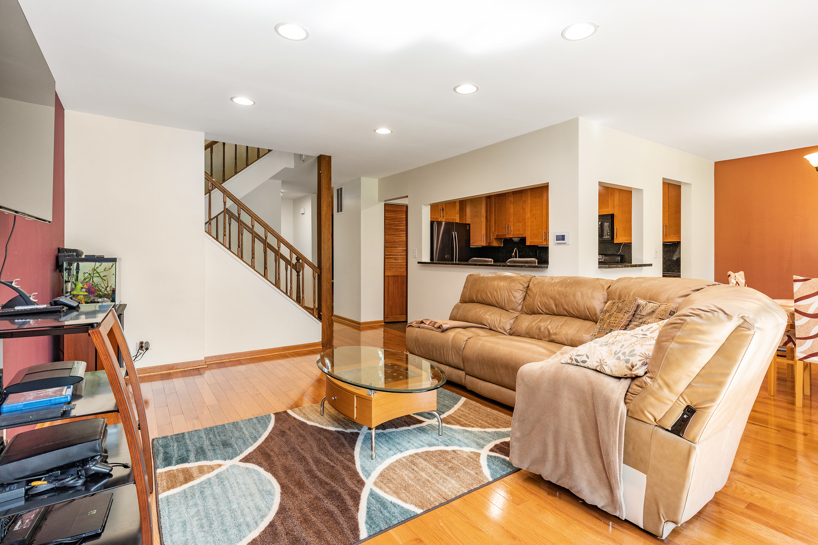 833 Swallow Street Deerfield, IL 60015 - Photo 7 of 37 a living room with furniture a rug and a flat screen tv