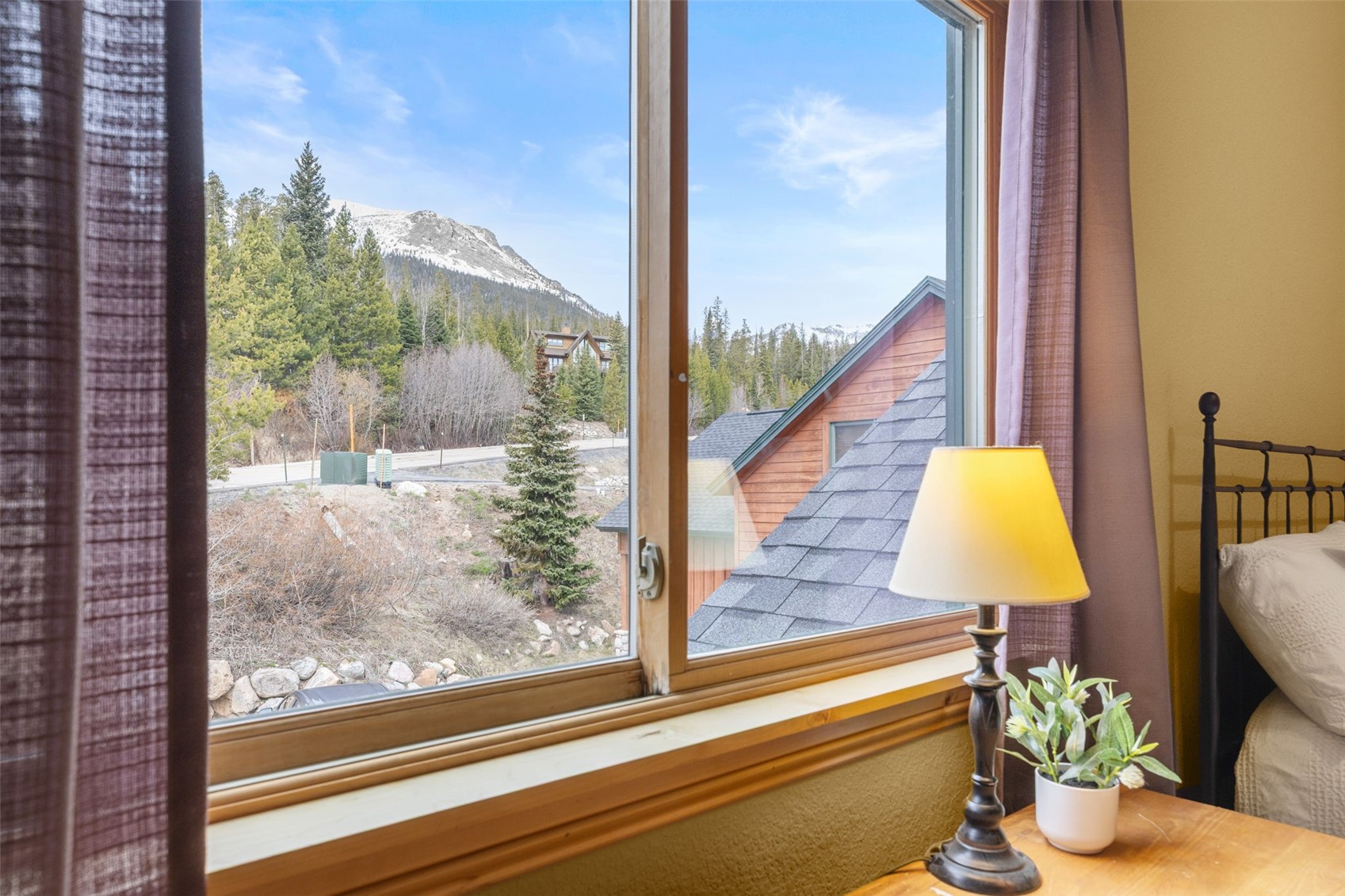 91795 Ryan Gulch Road Silverthorne, CO 80498 - Photo 36 of 50 a view of a room with a floor to ceiling window and wooden floor